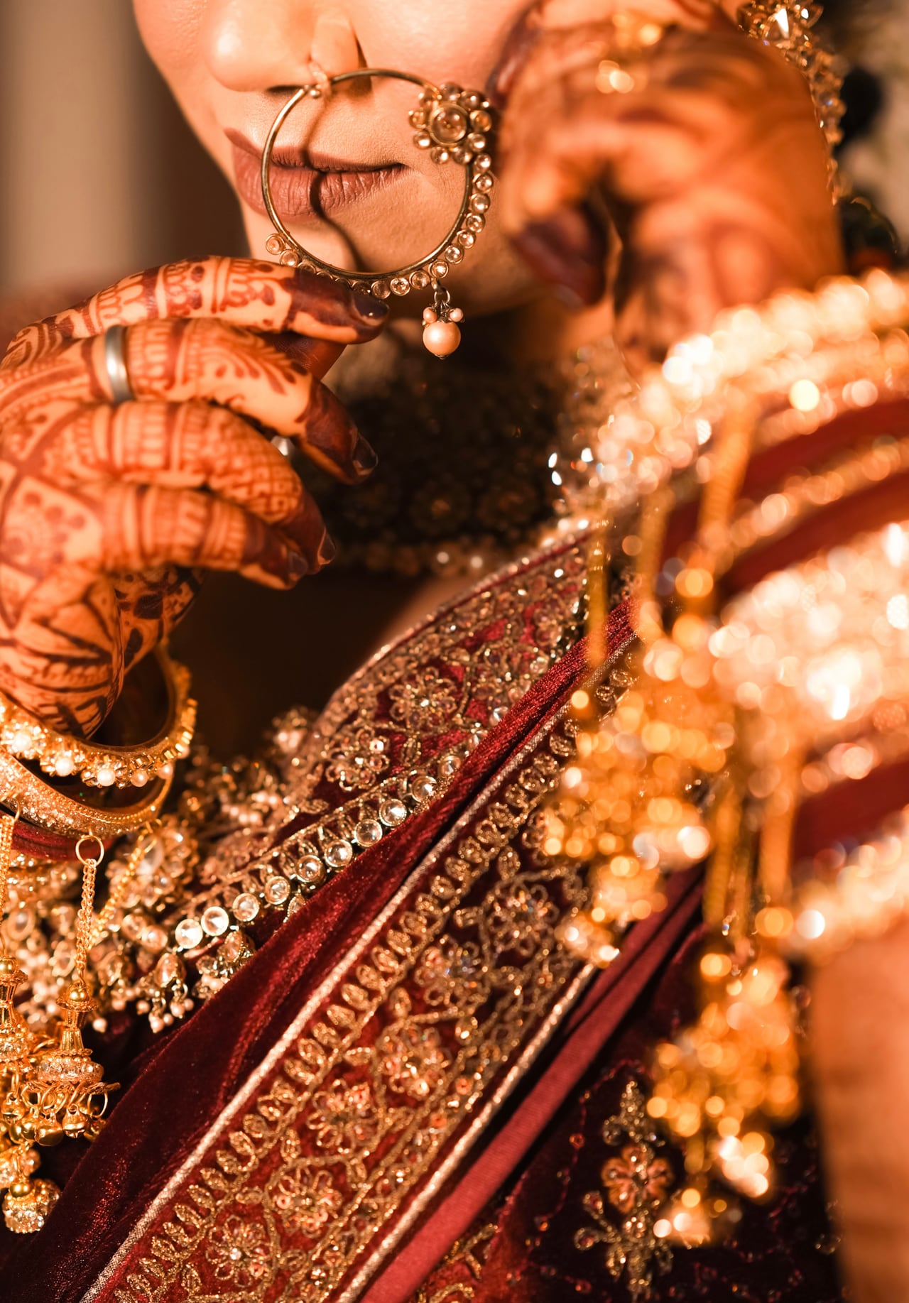 Bride wearing traditional wedding jewellery and mehendi